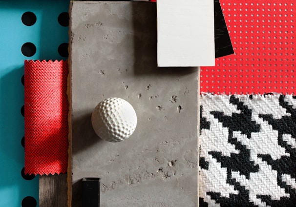 a table topped with lots of different types of fabric