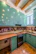 Image showing a renovated kitchen with new cabinets and vibrant colors.