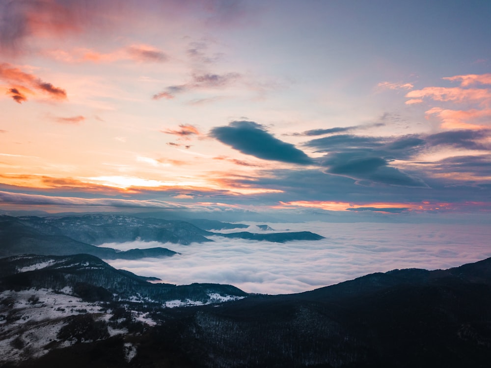 a view of a sunset over a mountain range