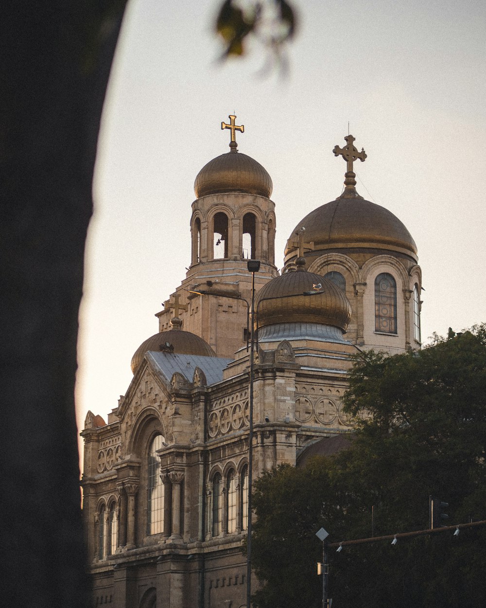 a large building with a cross on top of it