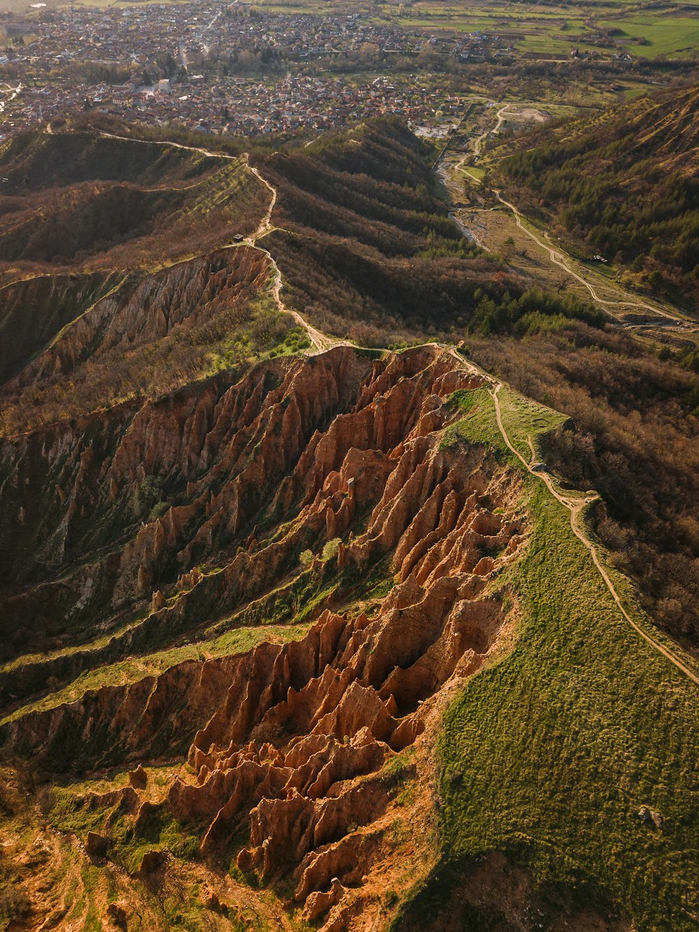 an aerial view of a mountainous area with a river running through it