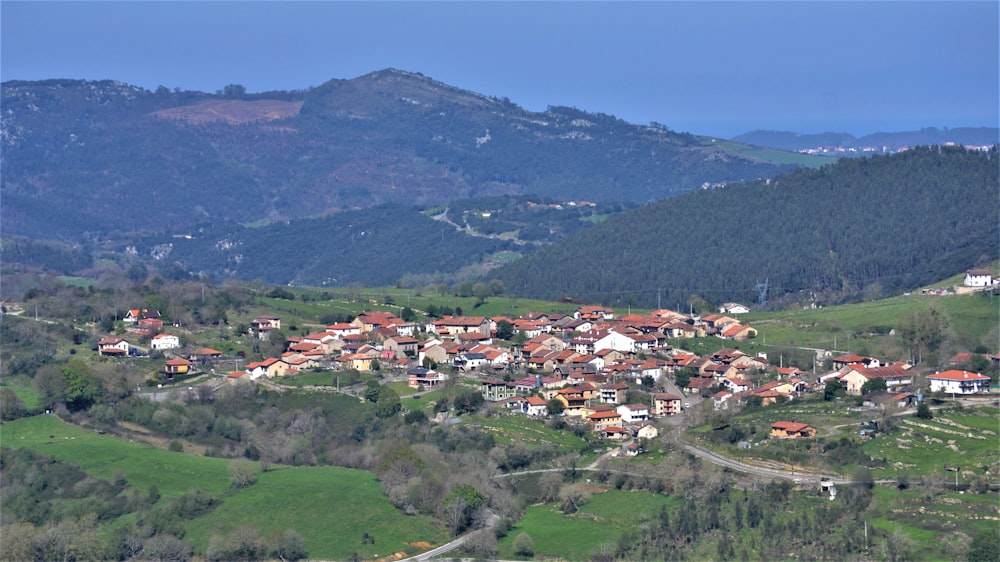 a small village nestled in a valley surrounded by mountains