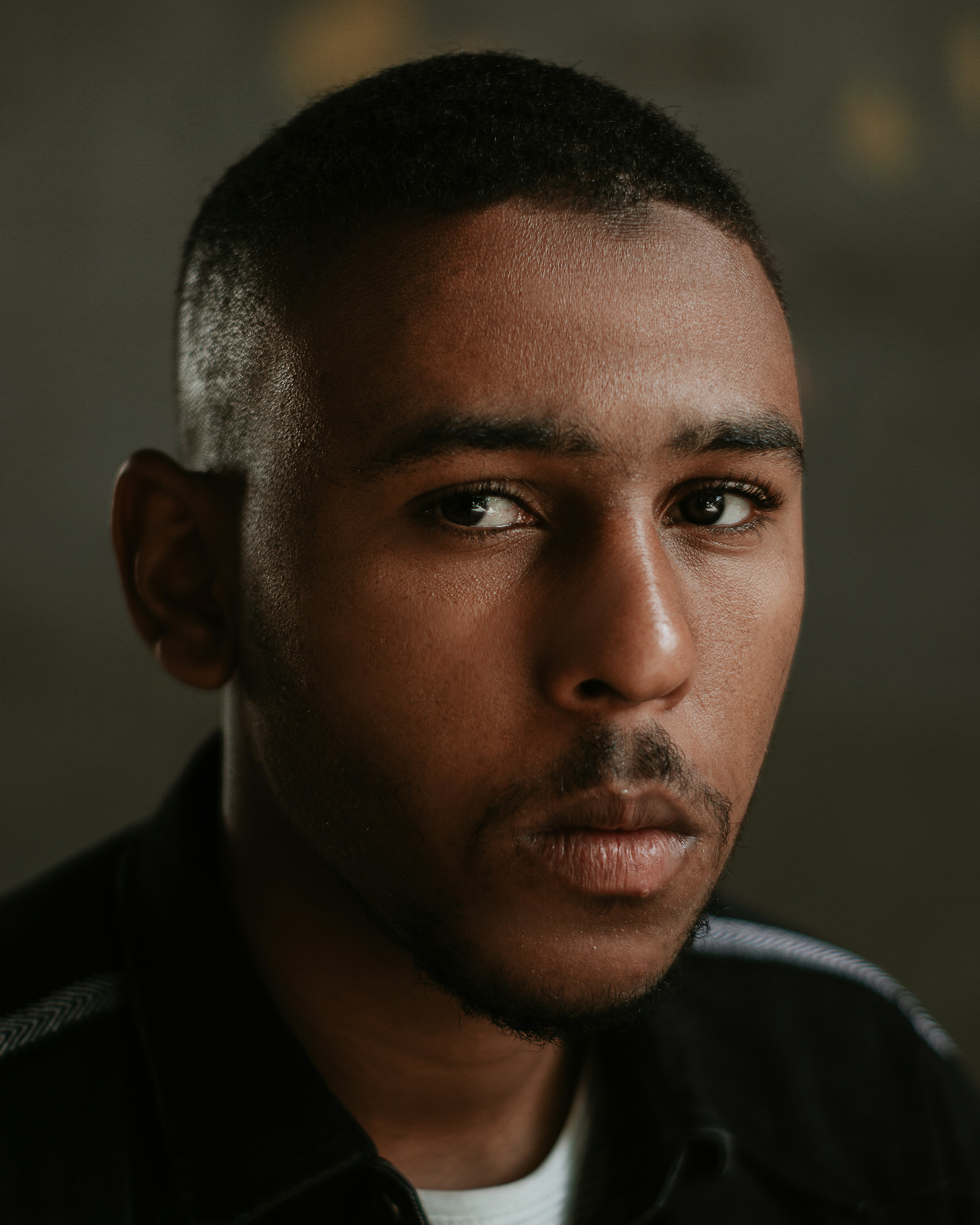 a close up of a person wearing a black jacket