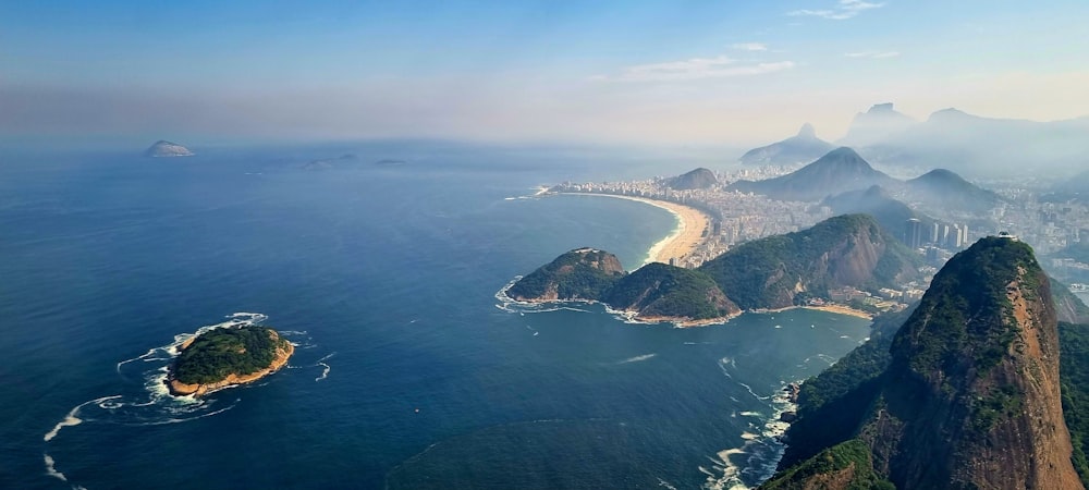 an aerial view of the coastline of a tropical island