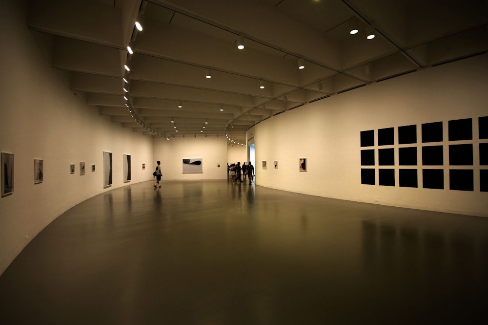 a group of people standing in a large room