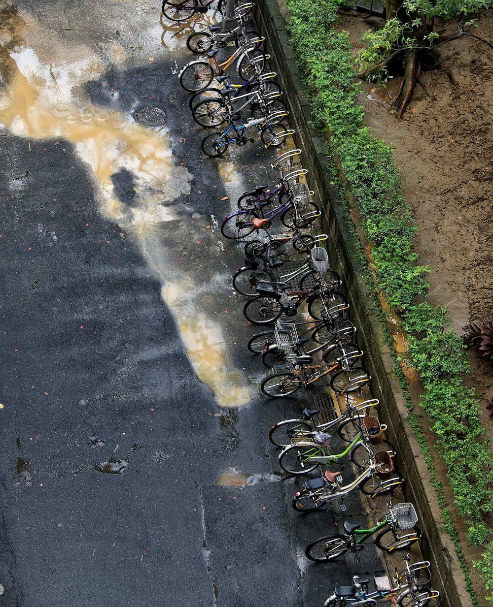 a parking lot filled with lots of bikes