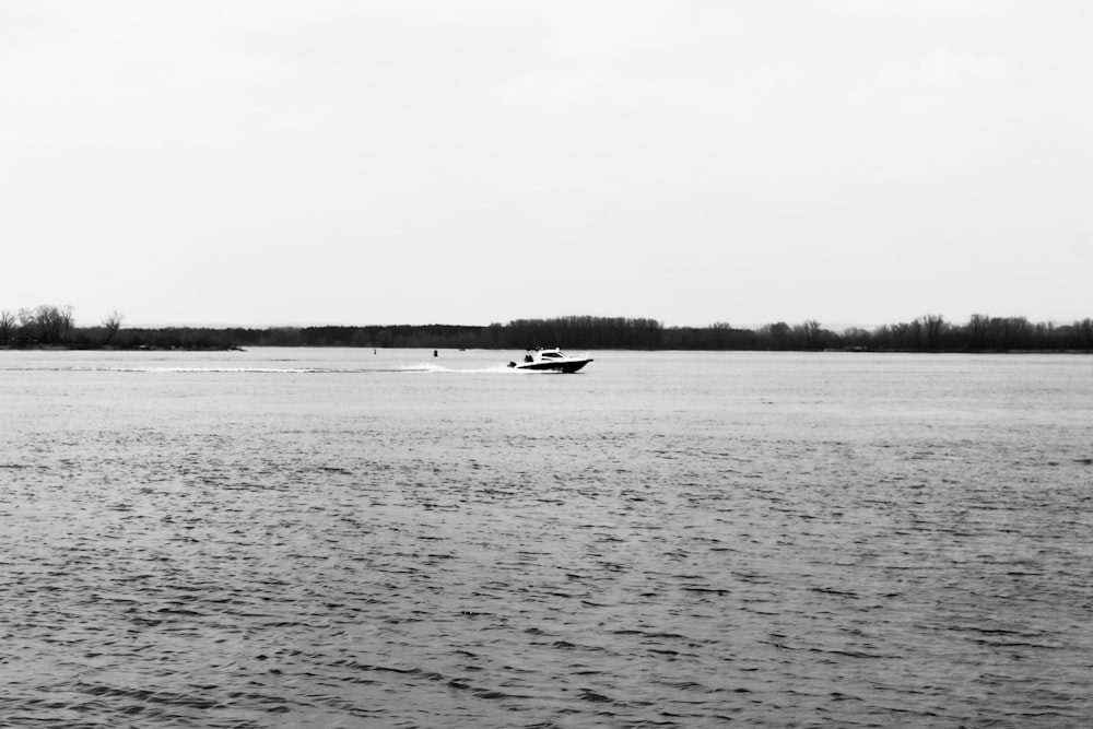 a boat traveling across a large body of water