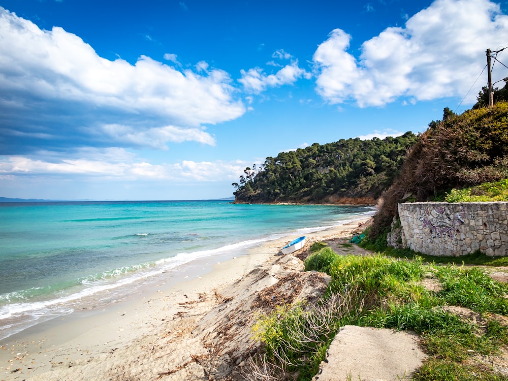 a view of a beach with a boat in the water