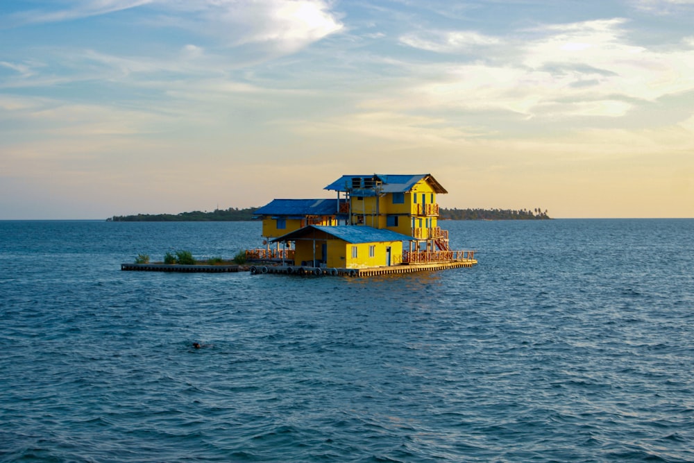a floating house in the middle of the ocean