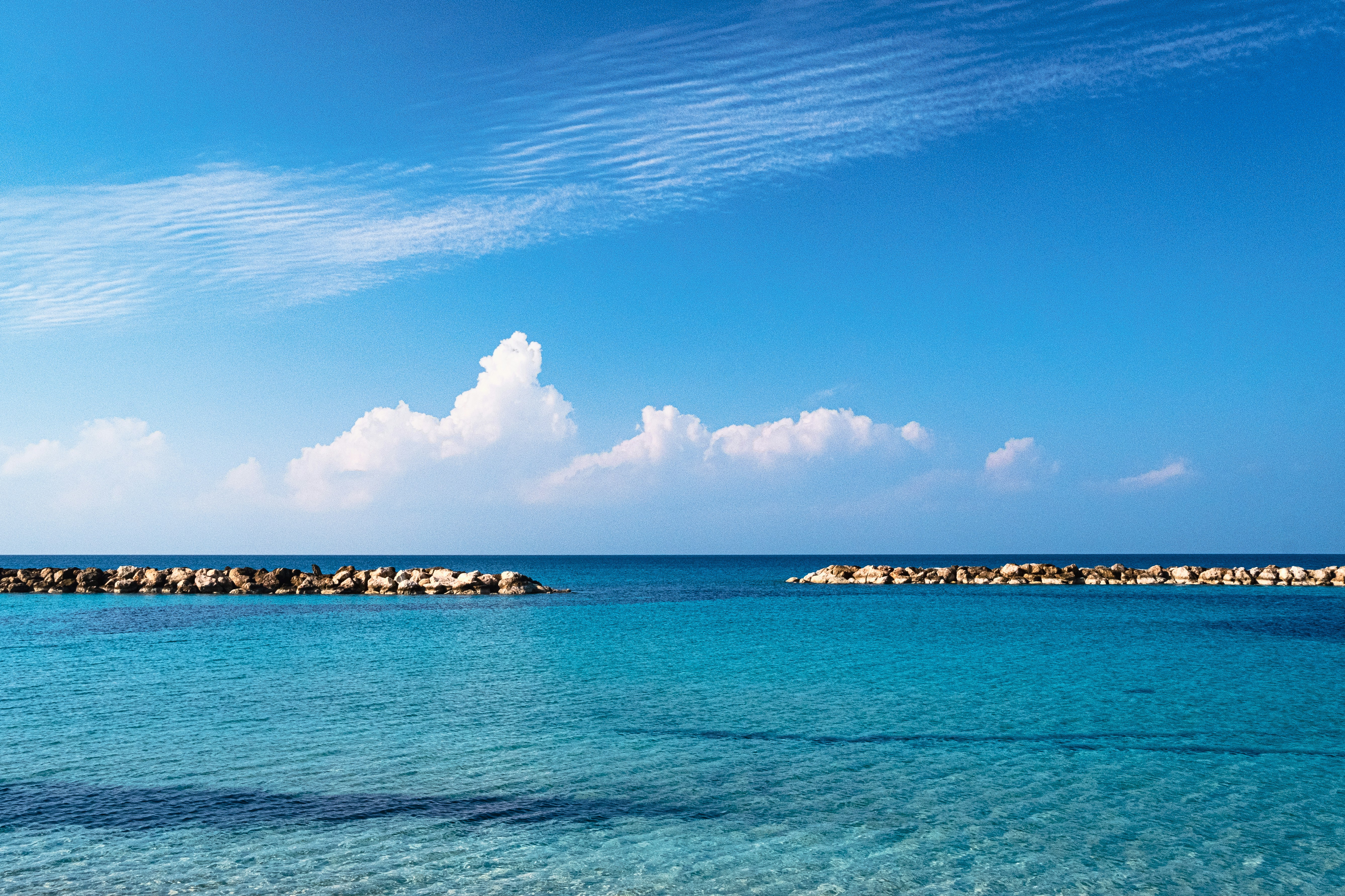 a body of water that has some rocks in it