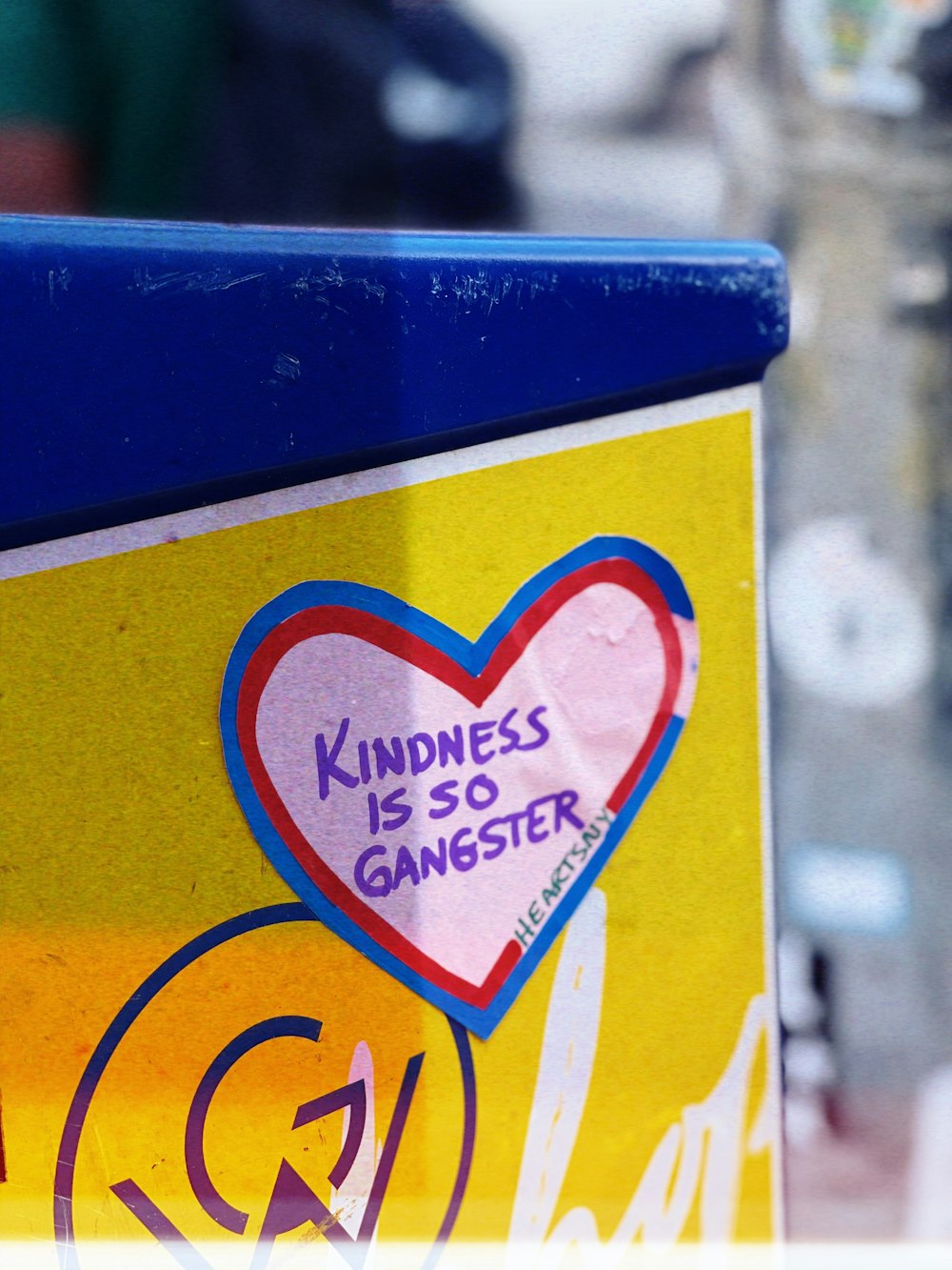 a close up of a sign with a heart on it