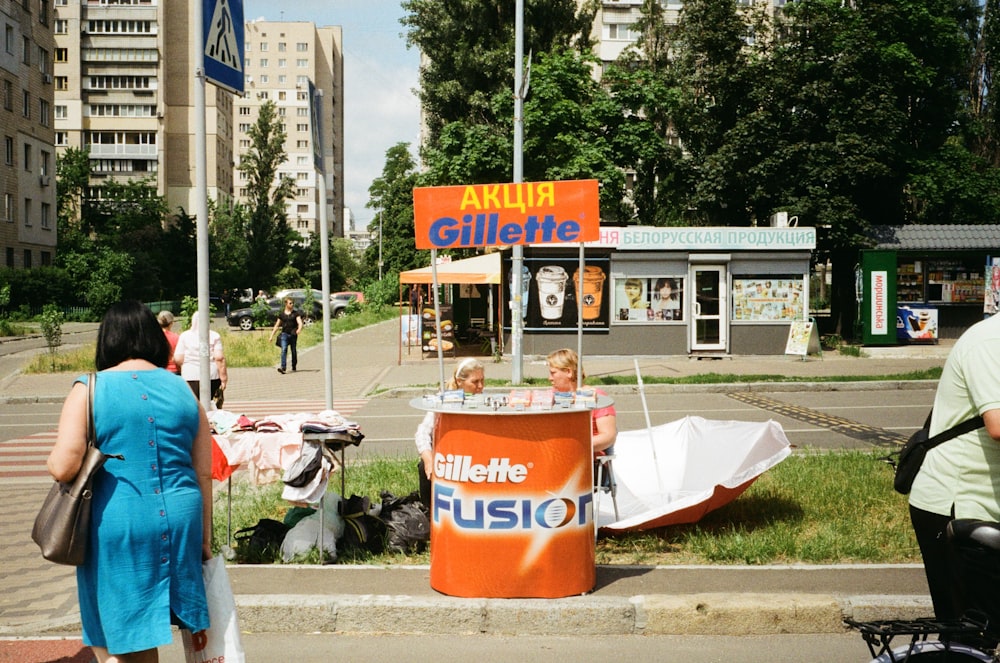 a man and a woman standing on the side of a road