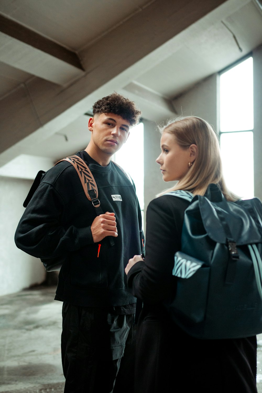 a man and a woman standing next to each other