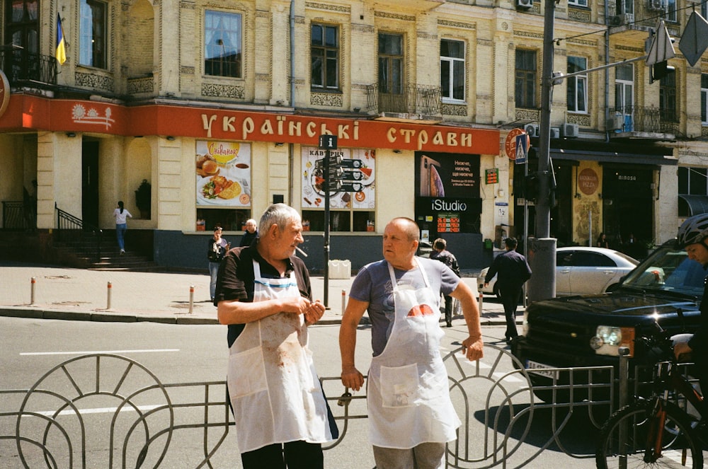 a couple of people that are standing in the street