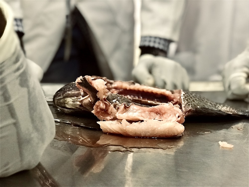 a close up of a piece of fish on a table