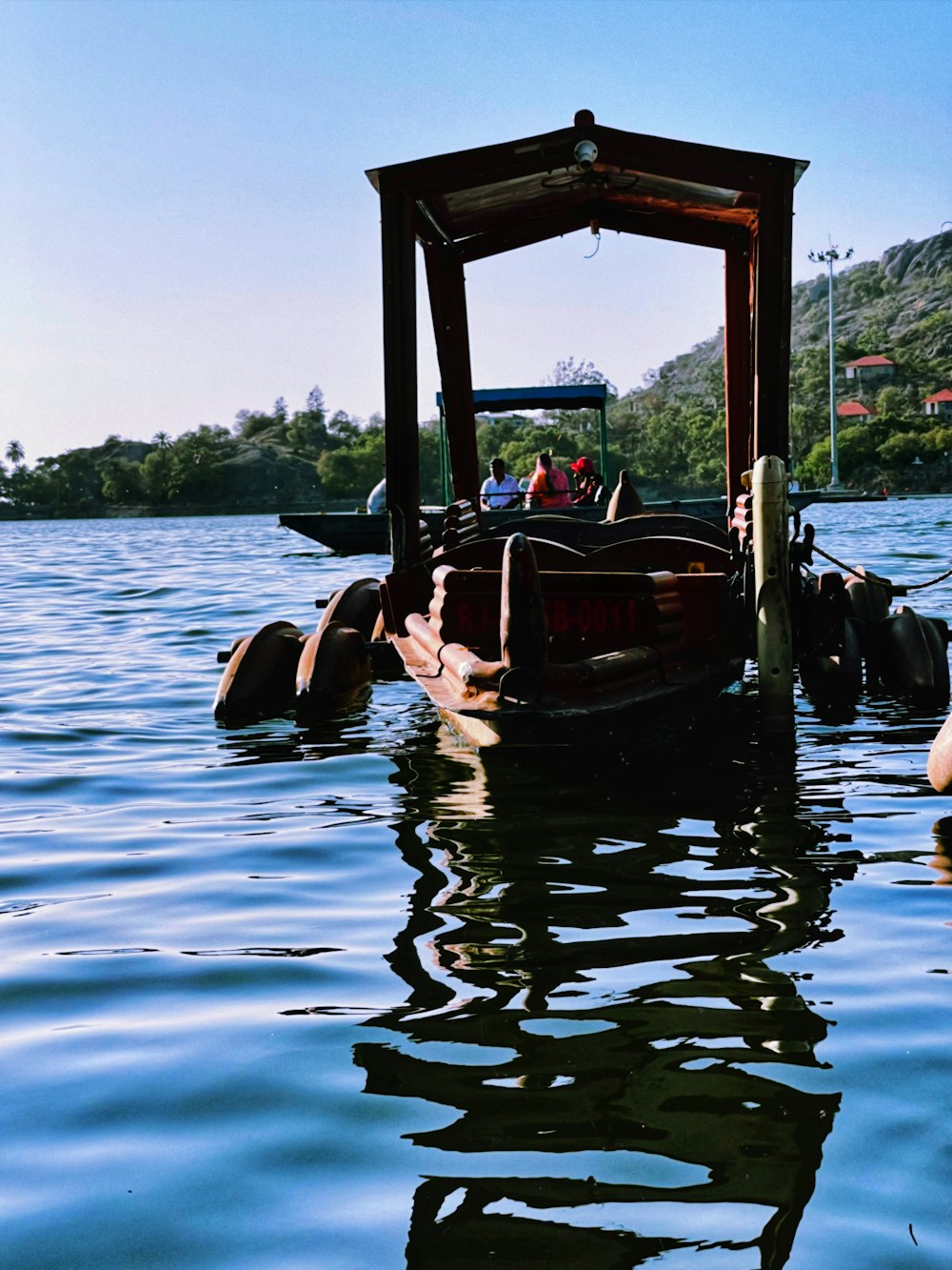 a boat floating on top of a body of water