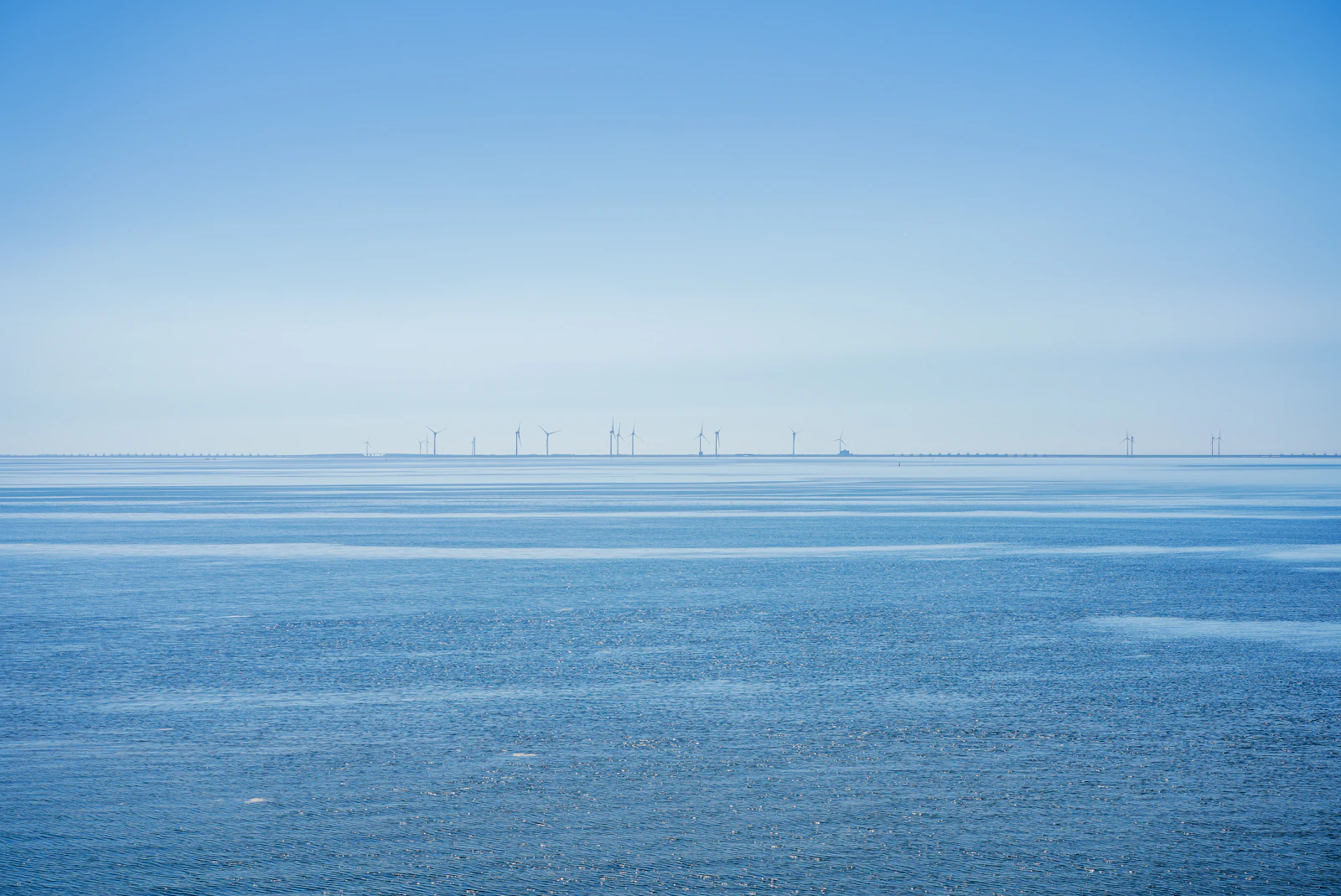 Oosterschelde barrier visible across calm blue water