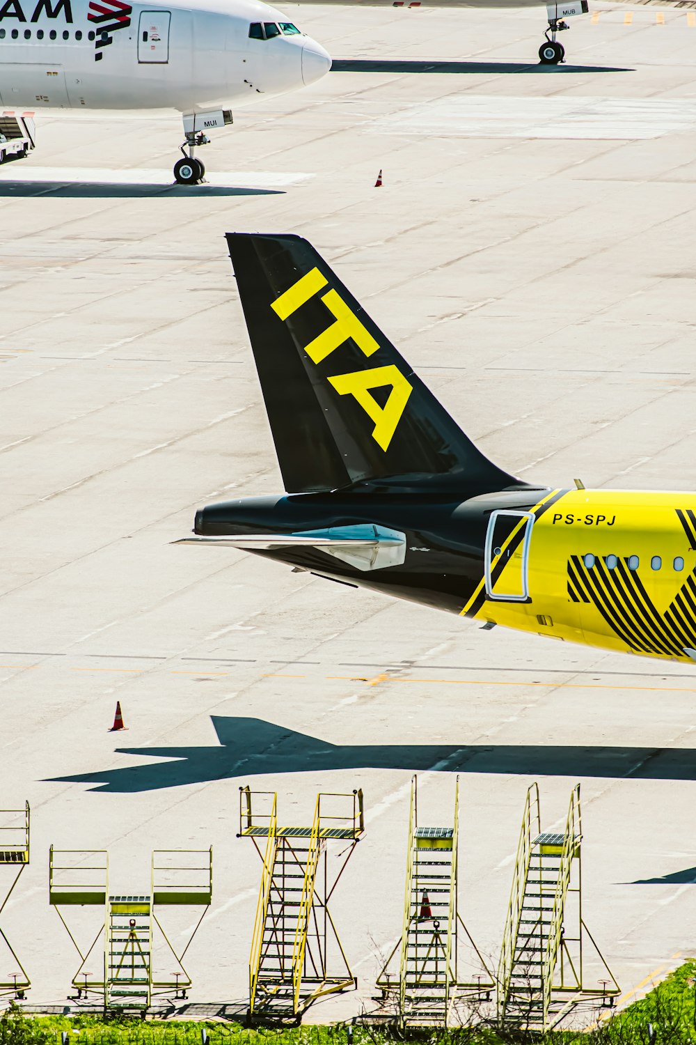 a large jetliner sitting on top of an airport tarmac