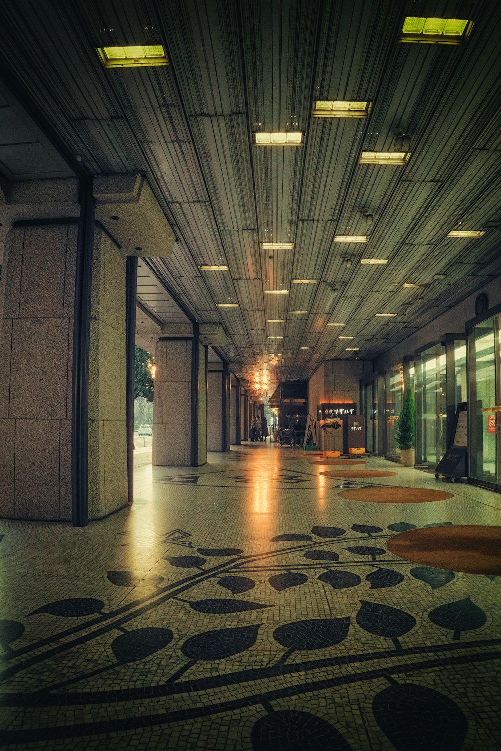 a long hallway with a clock on the wall