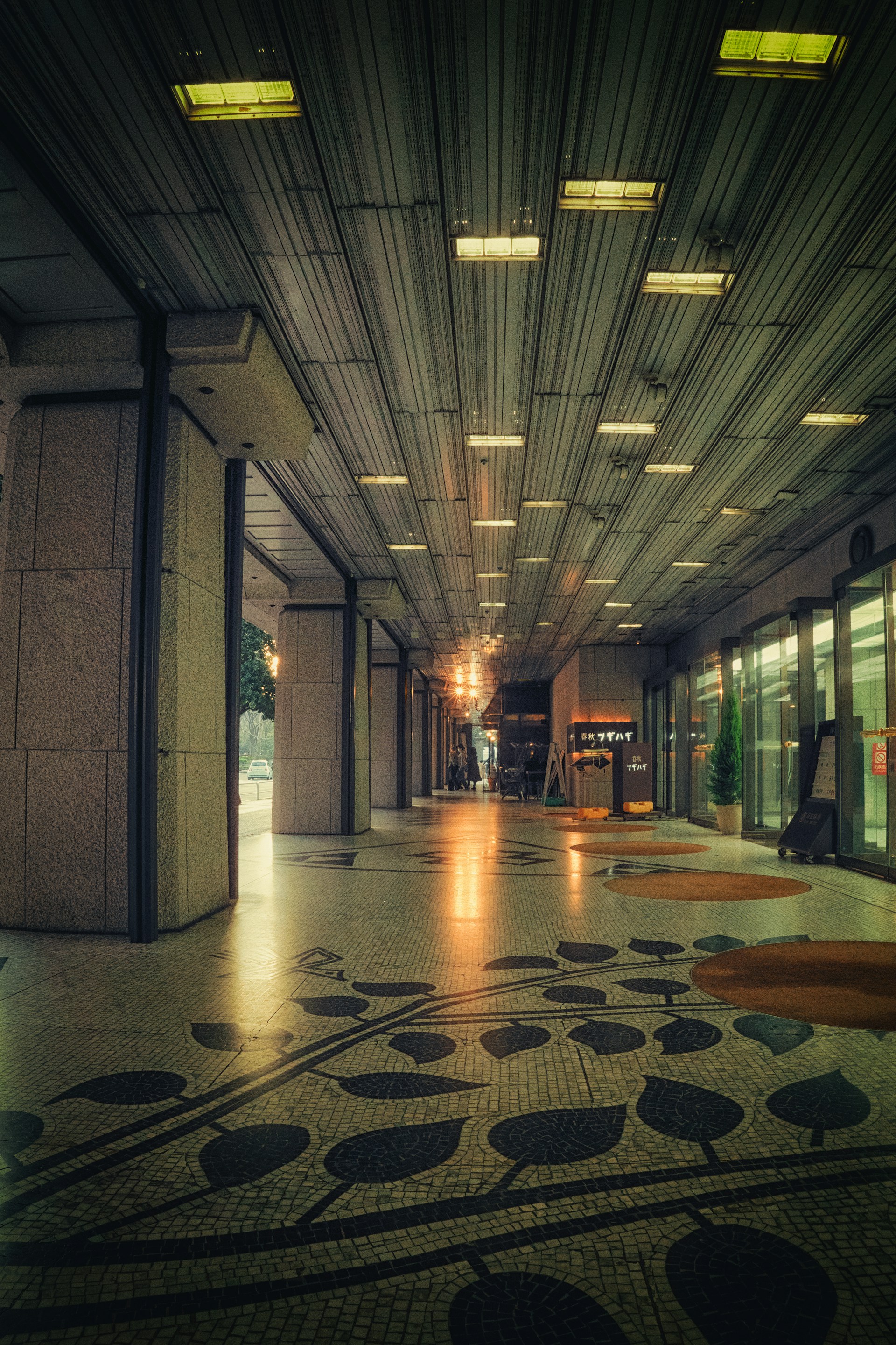 a long hallway with a clock on the wall