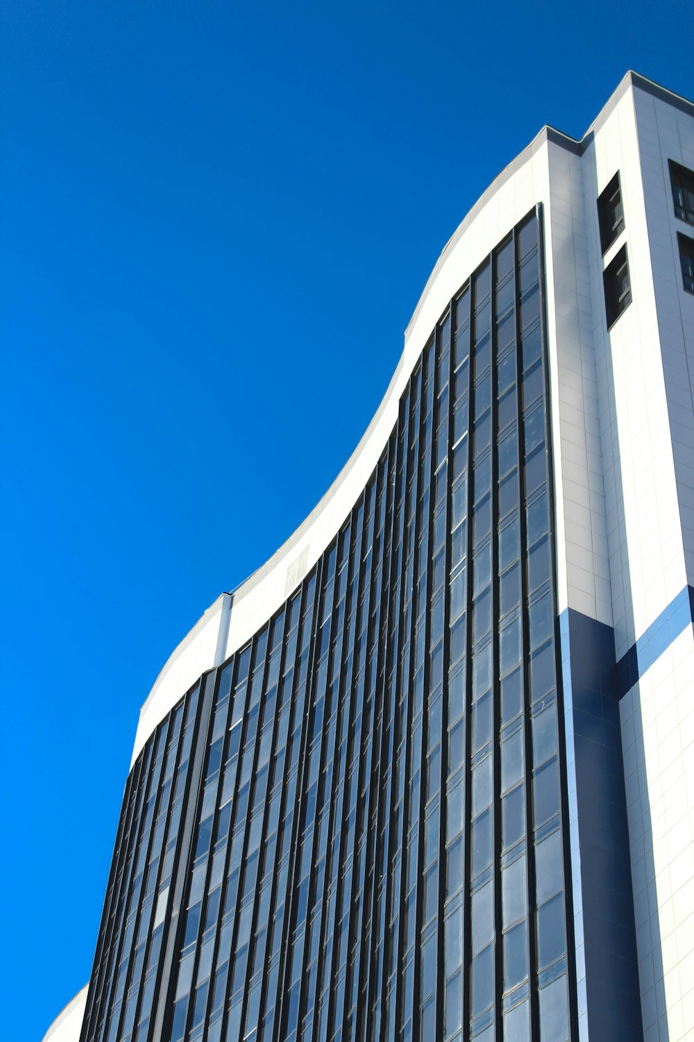 a tall building with a blue sky in the background