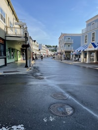 a city street with a fire hydrant in the middle of it