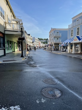 a city street with a fire hydrant in the middle of it