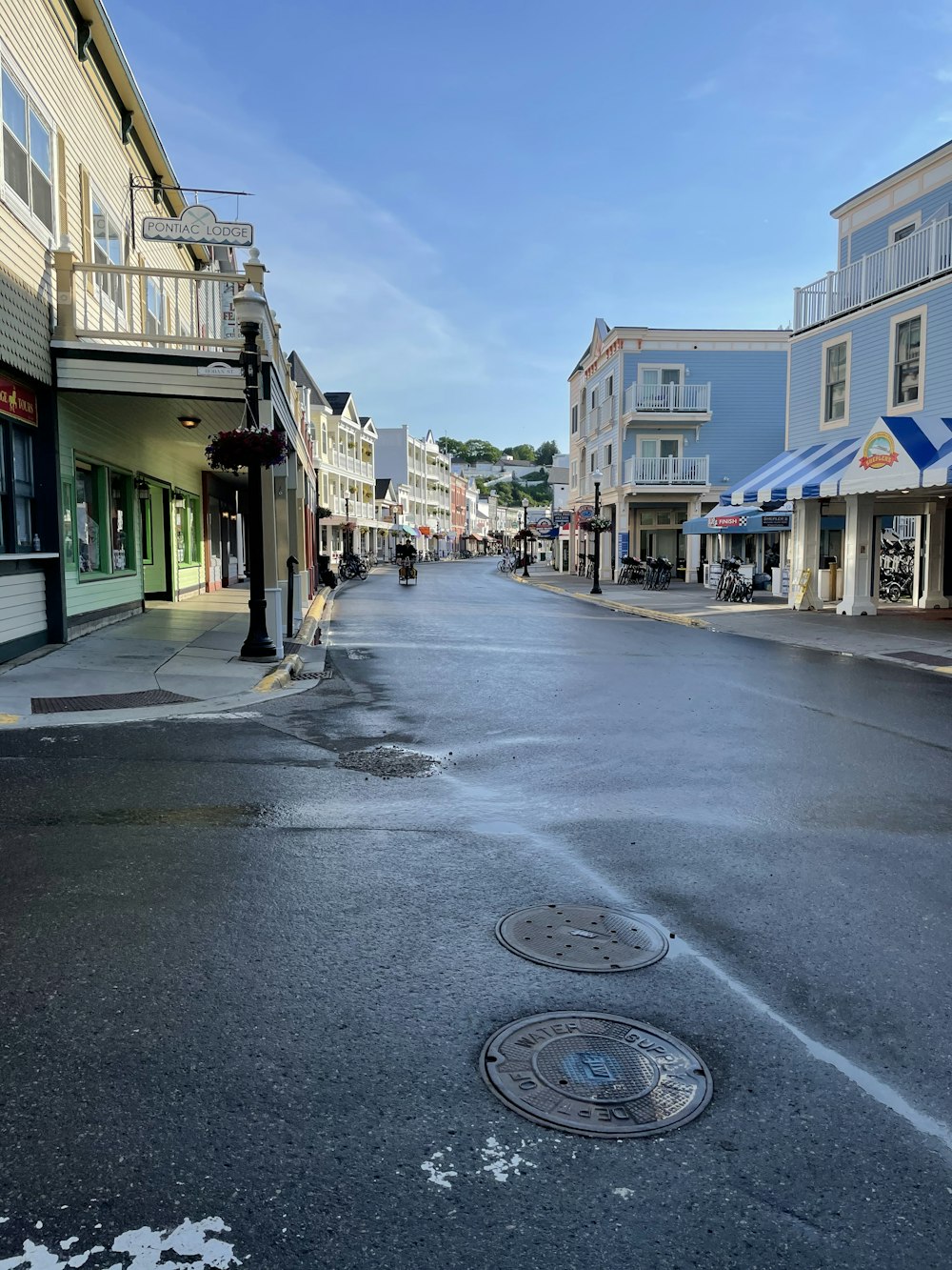 a city street with a fire hydrant in the middle of it