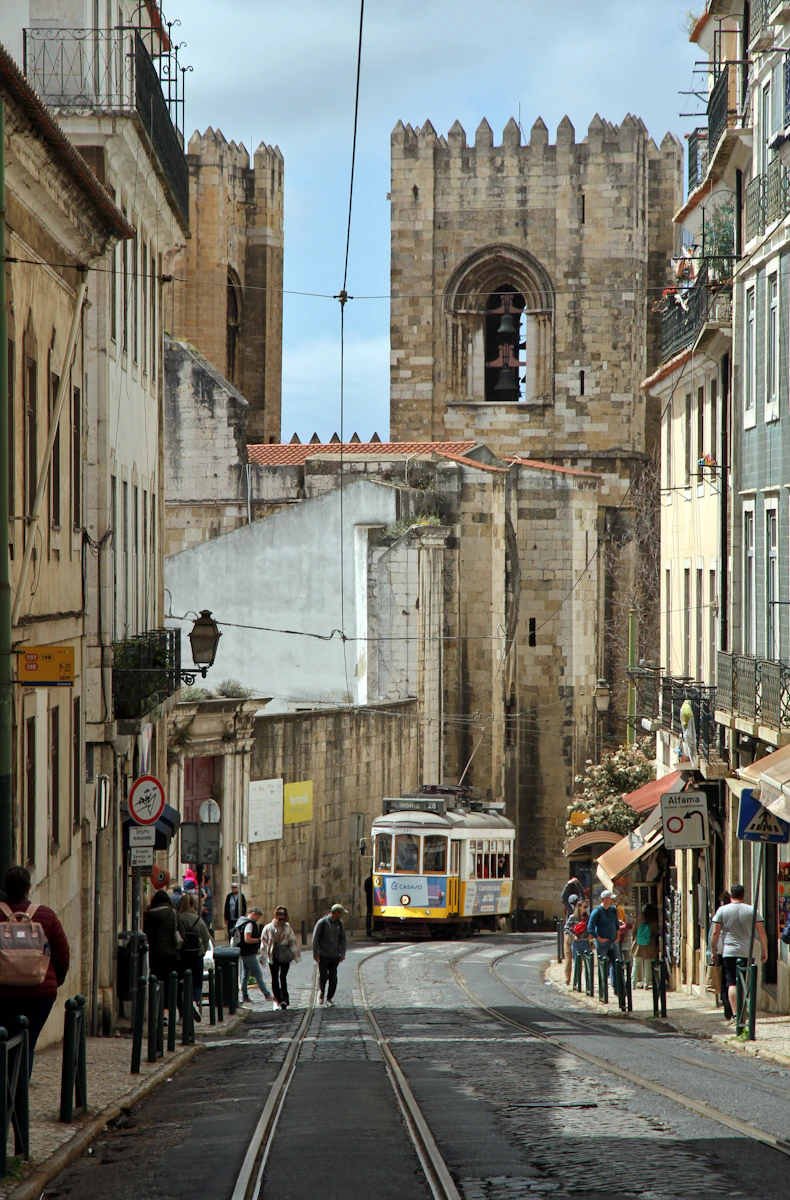 a street scene with people walking on the side of the road