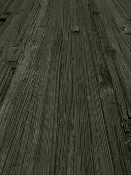 Close-up of wood grain and metal joints on a custom furniture piece.