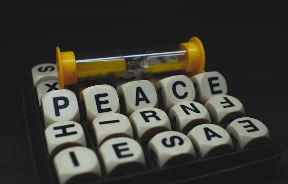 a close up of a typewriter with a pill on top of it