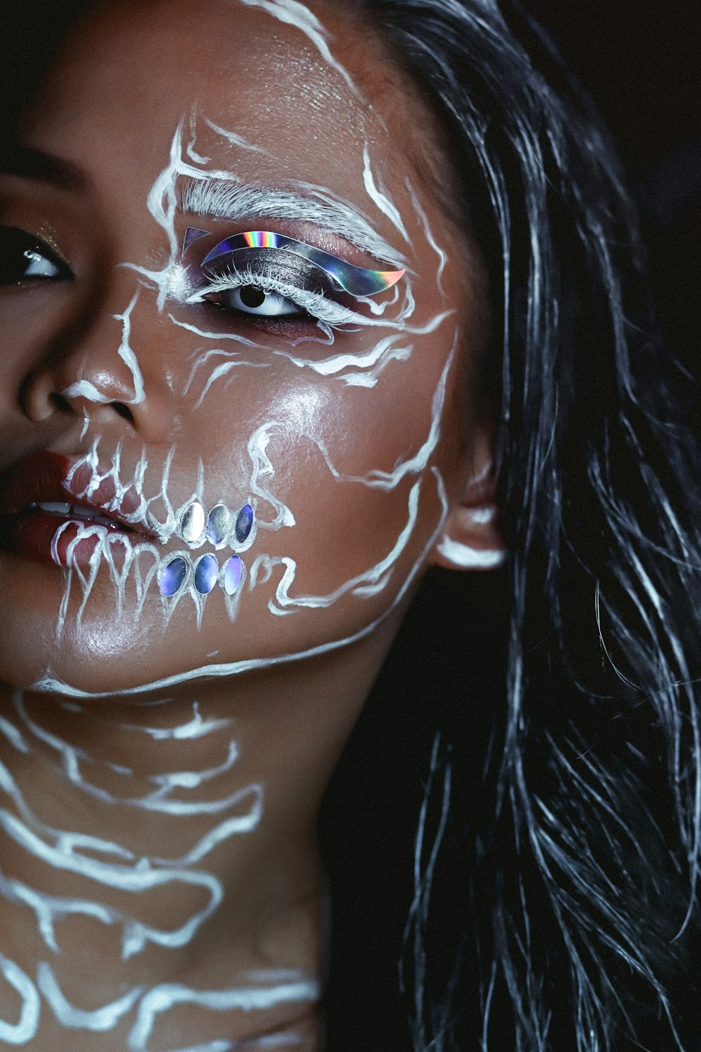 a woman with a skeleton painted on her face