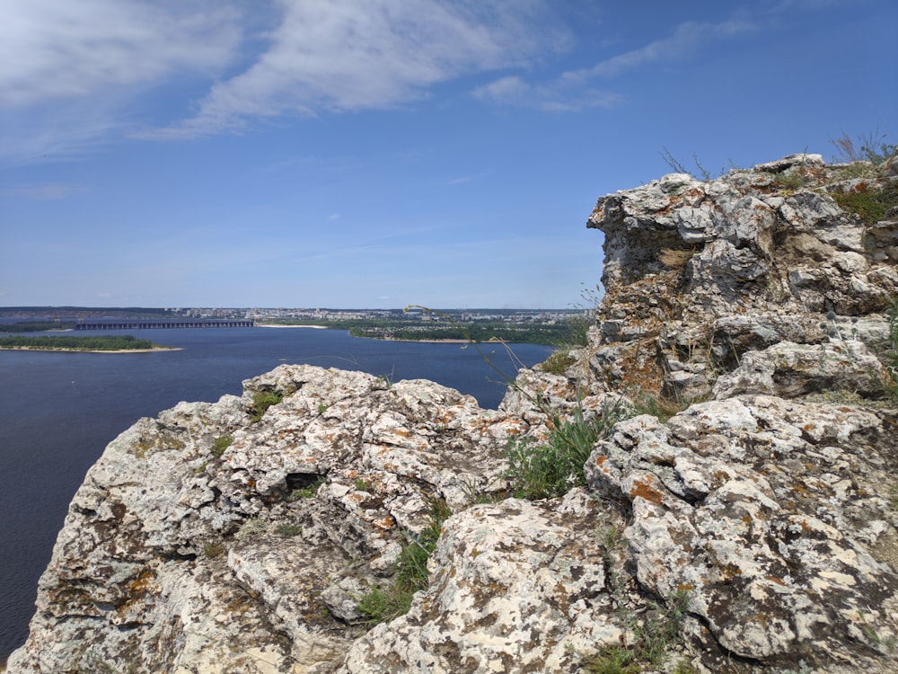 a view of a body of water from a rocky outcropping