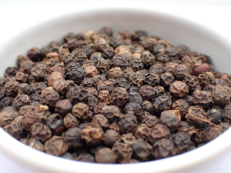 Whole black peppercorns