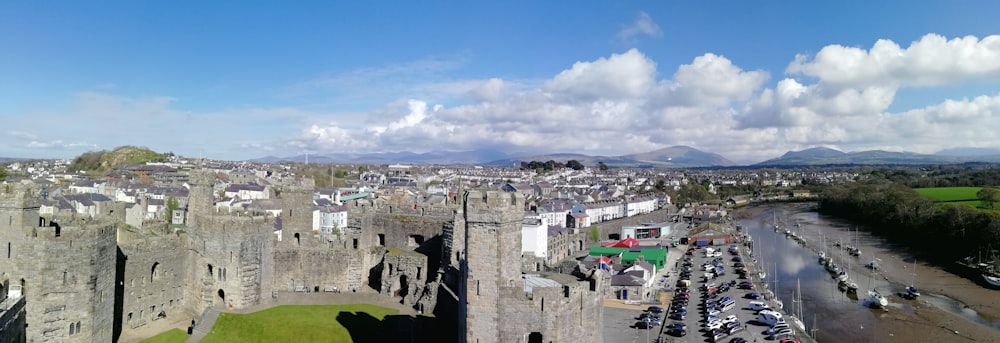 an aerial view of a castle with a parking lot in front of it