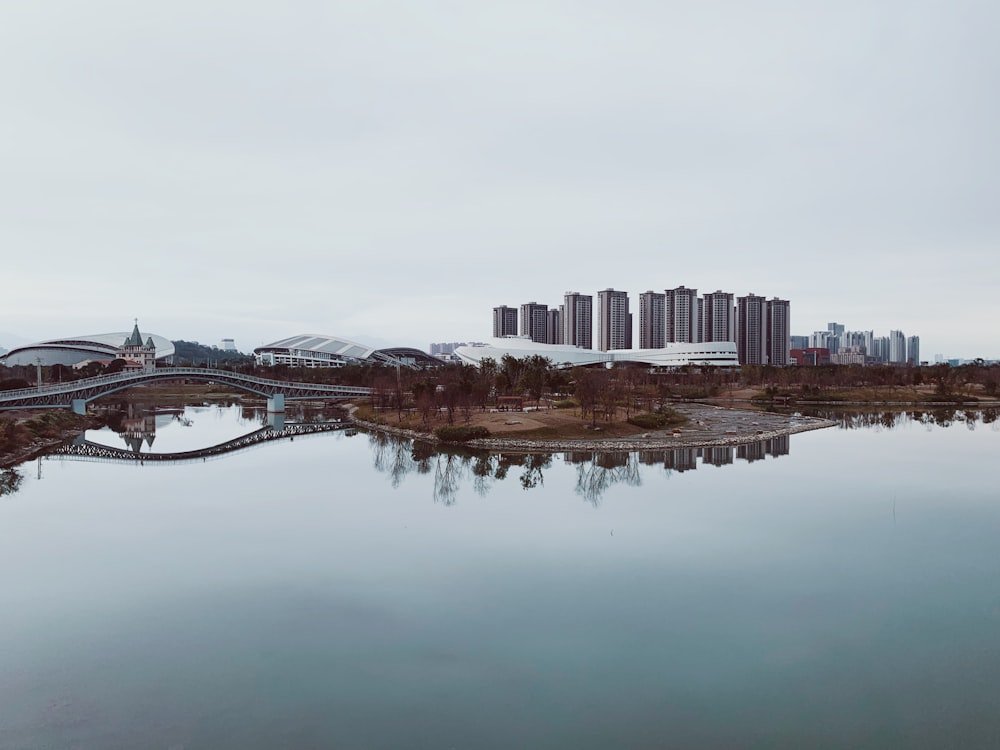 a large body of water with a city in the background