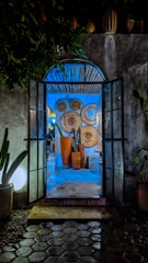 Entrance to the room decorated with vibrant flowers and traditional pottery.