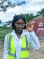 a woman wearing a safety vest and glasses
