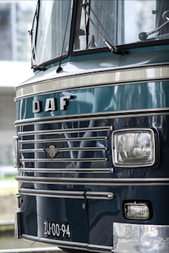 a close up of the front of a blue bus
