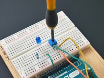 a soldering soldering tool is attached to a bread board