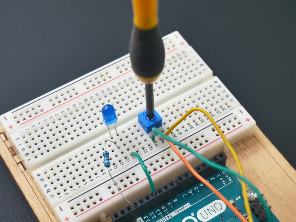 a soldering soldering tool is attached to a bread board