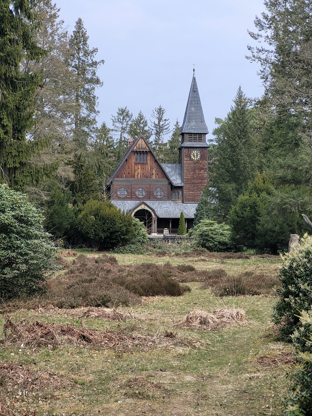 an old church in the middle of a forest
