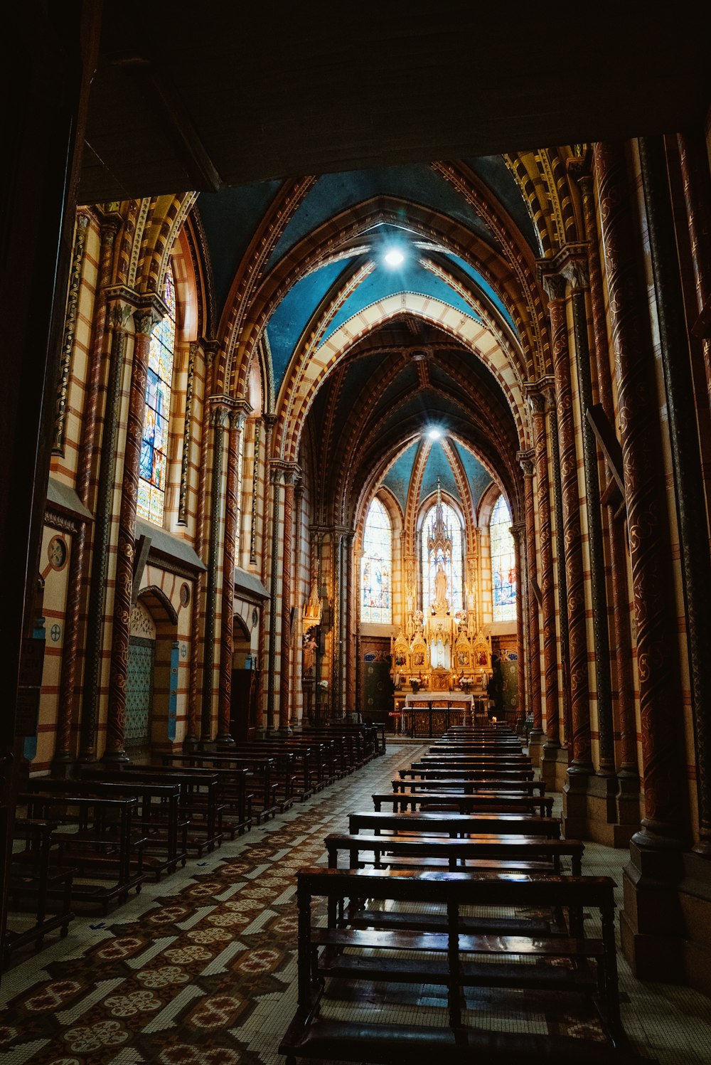 a church with a lot of benches inside of it