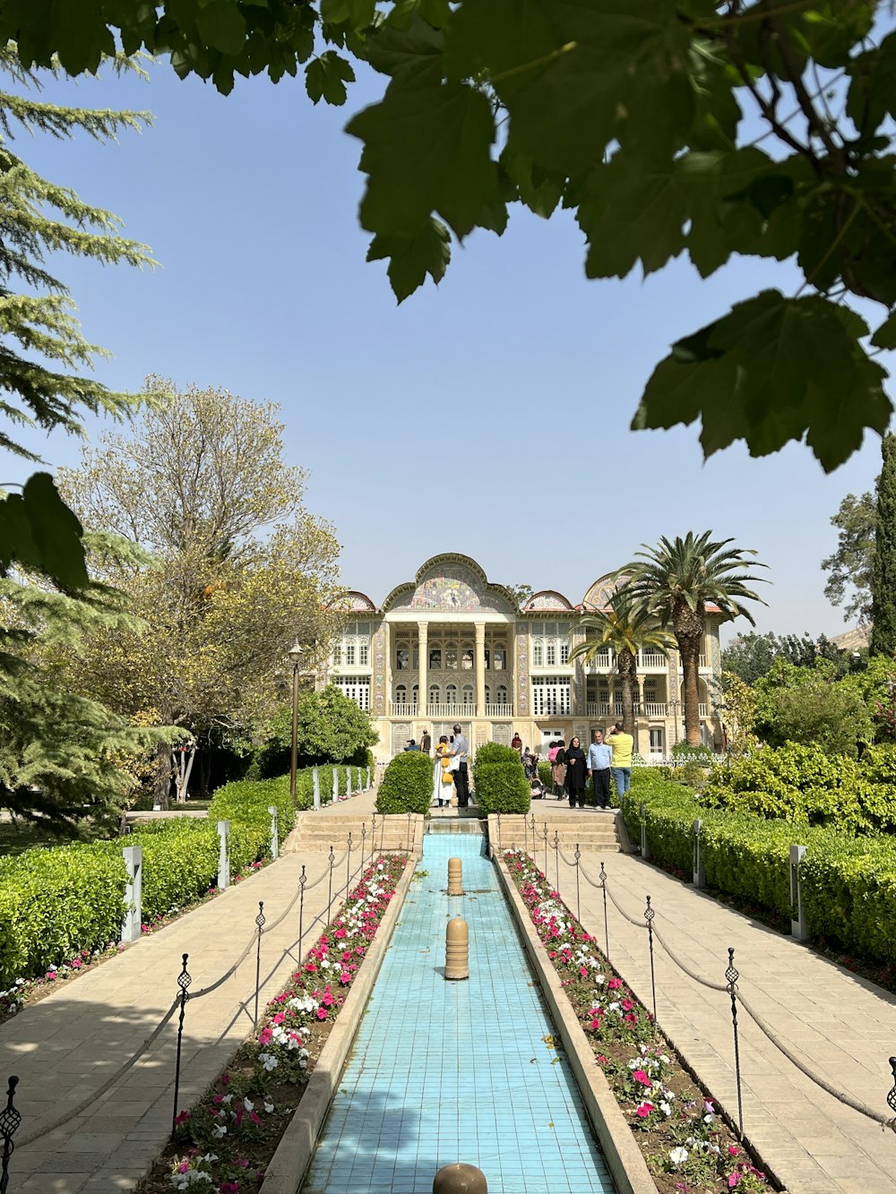 a large building with a pool in the middle of it