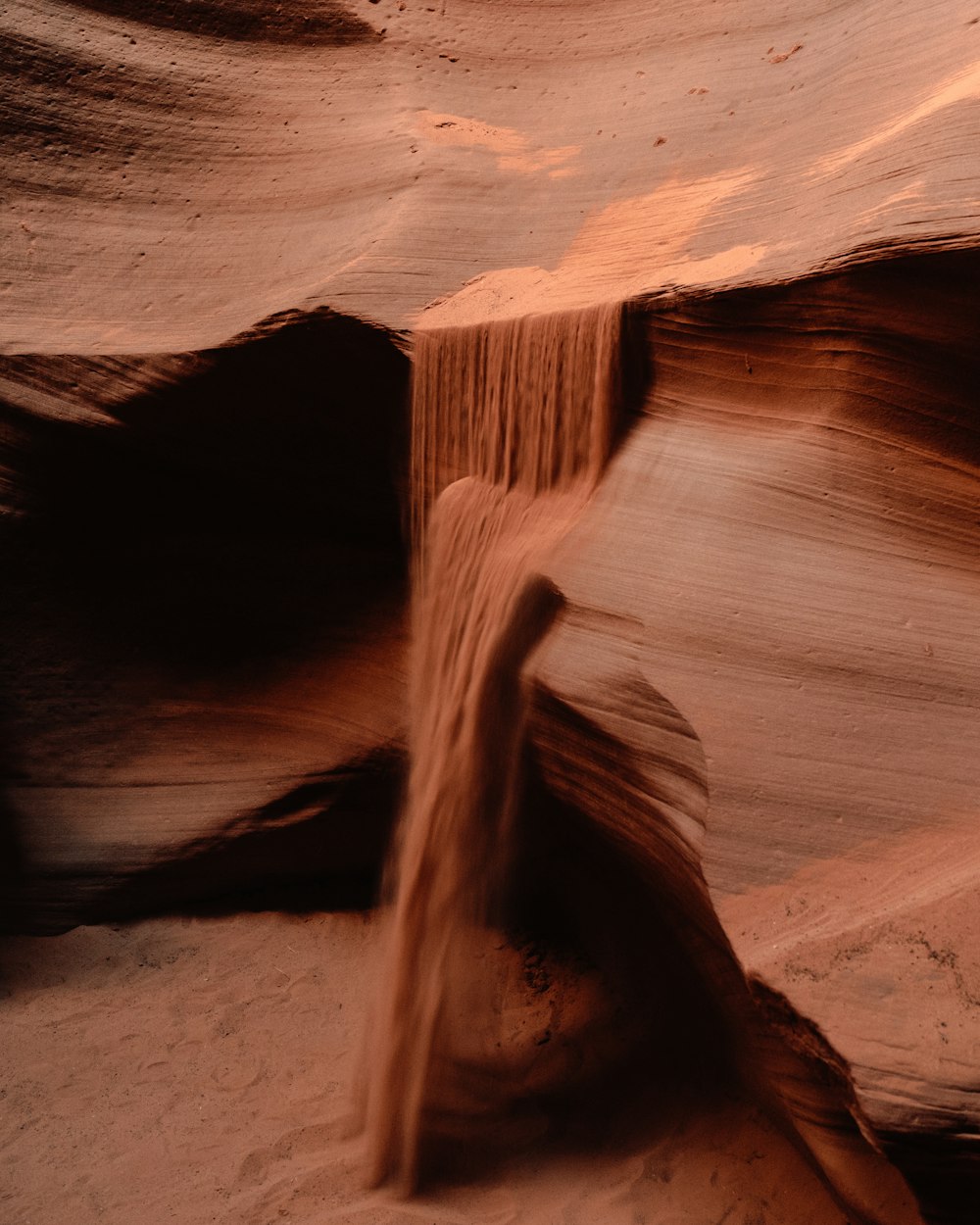 a stream of water running through a canyon