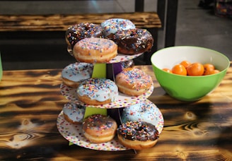 A creative setup of mini donuts on a colorful table.