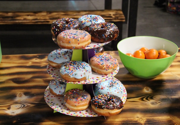 A creative setup of mini donuts on a colorful table.