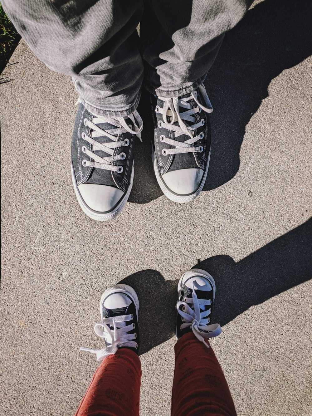 a pair of feet standing next to each other