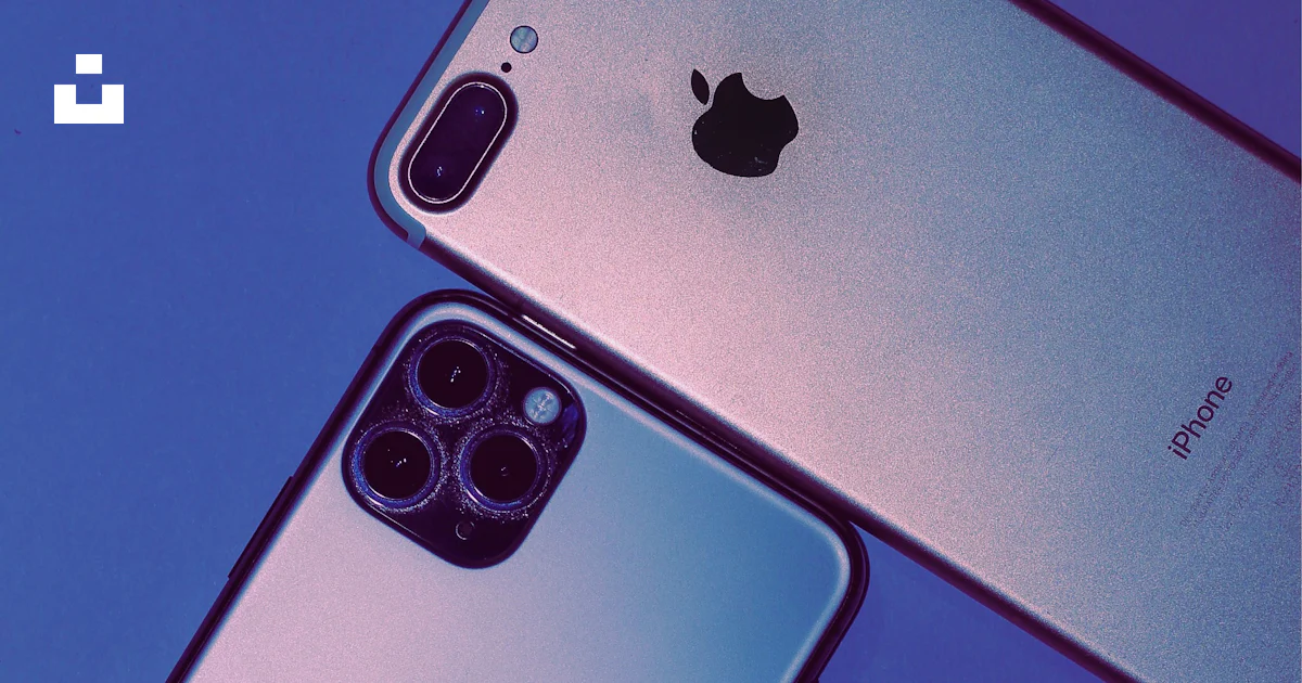 Two iphones side by side on a blue background photo – Free Iphone Image ...