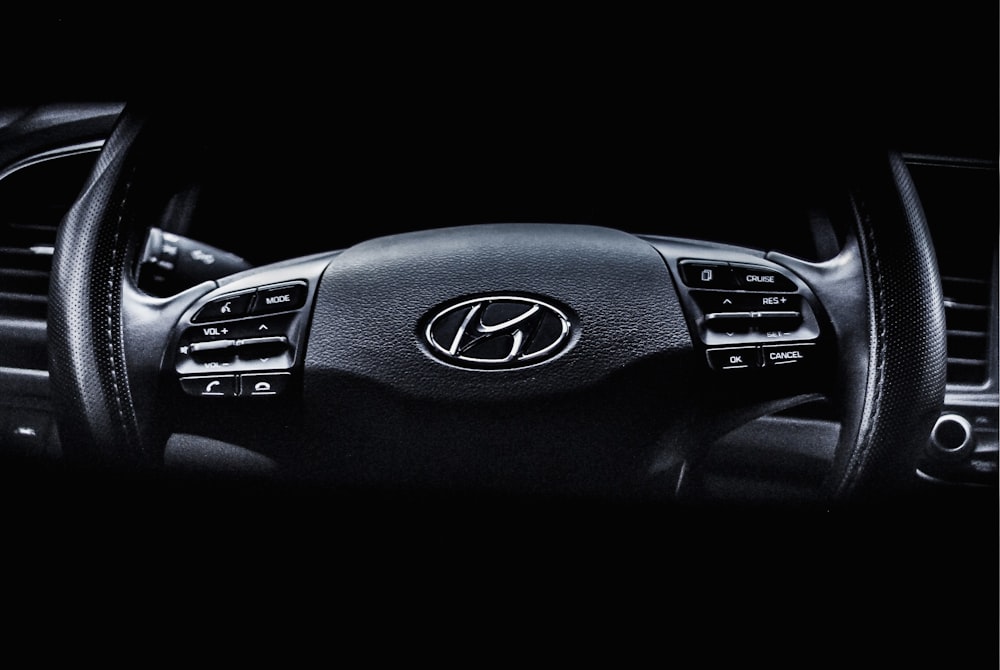 a black and white photo of a car dashboard